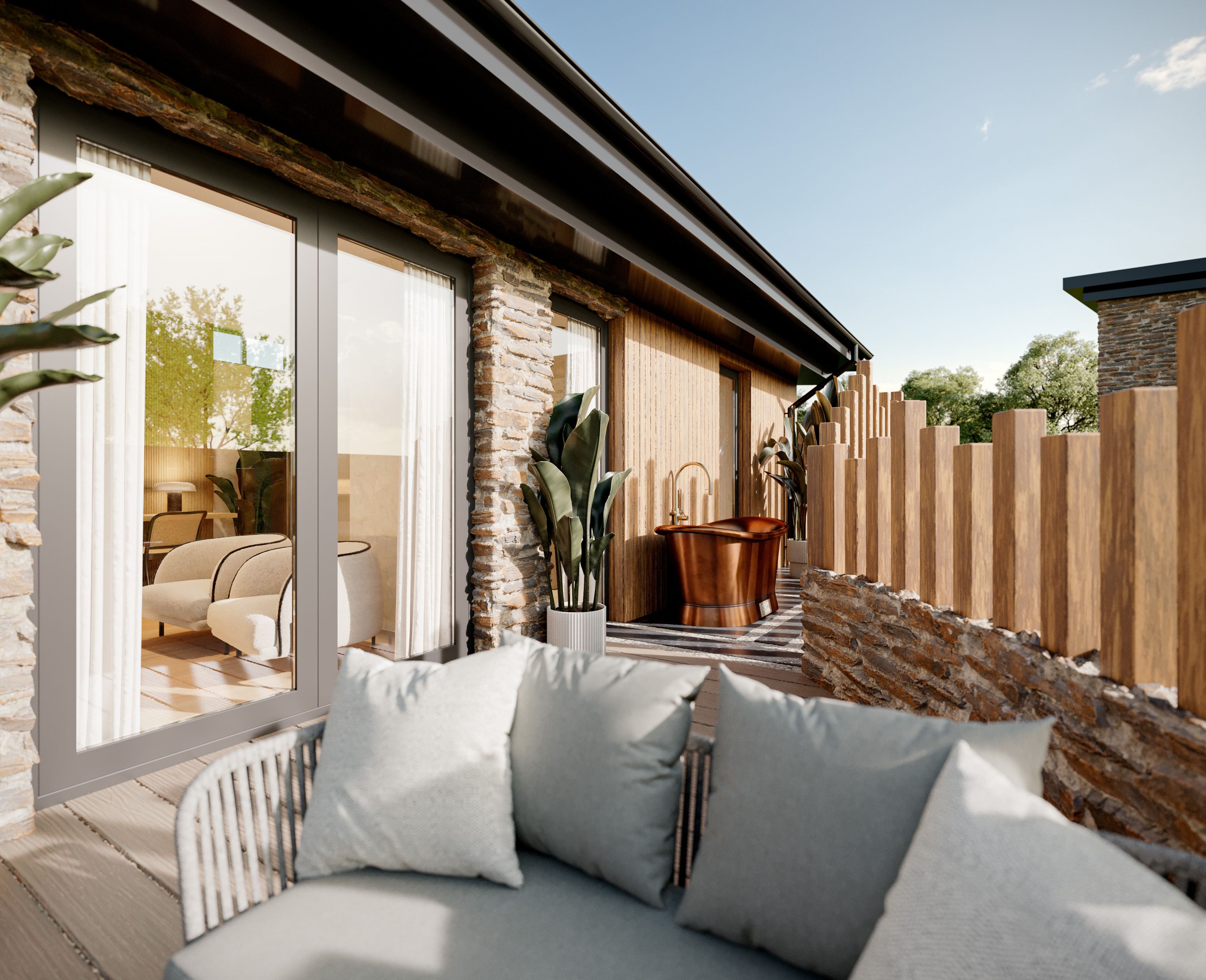 Luxury suite with stone walls, outdoor seating area, potted plants, and a copper bathtub on a private terrace