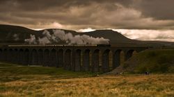 Yorkshire Dales Ribblehead Viaduct with a train passing in the autumnal weather.