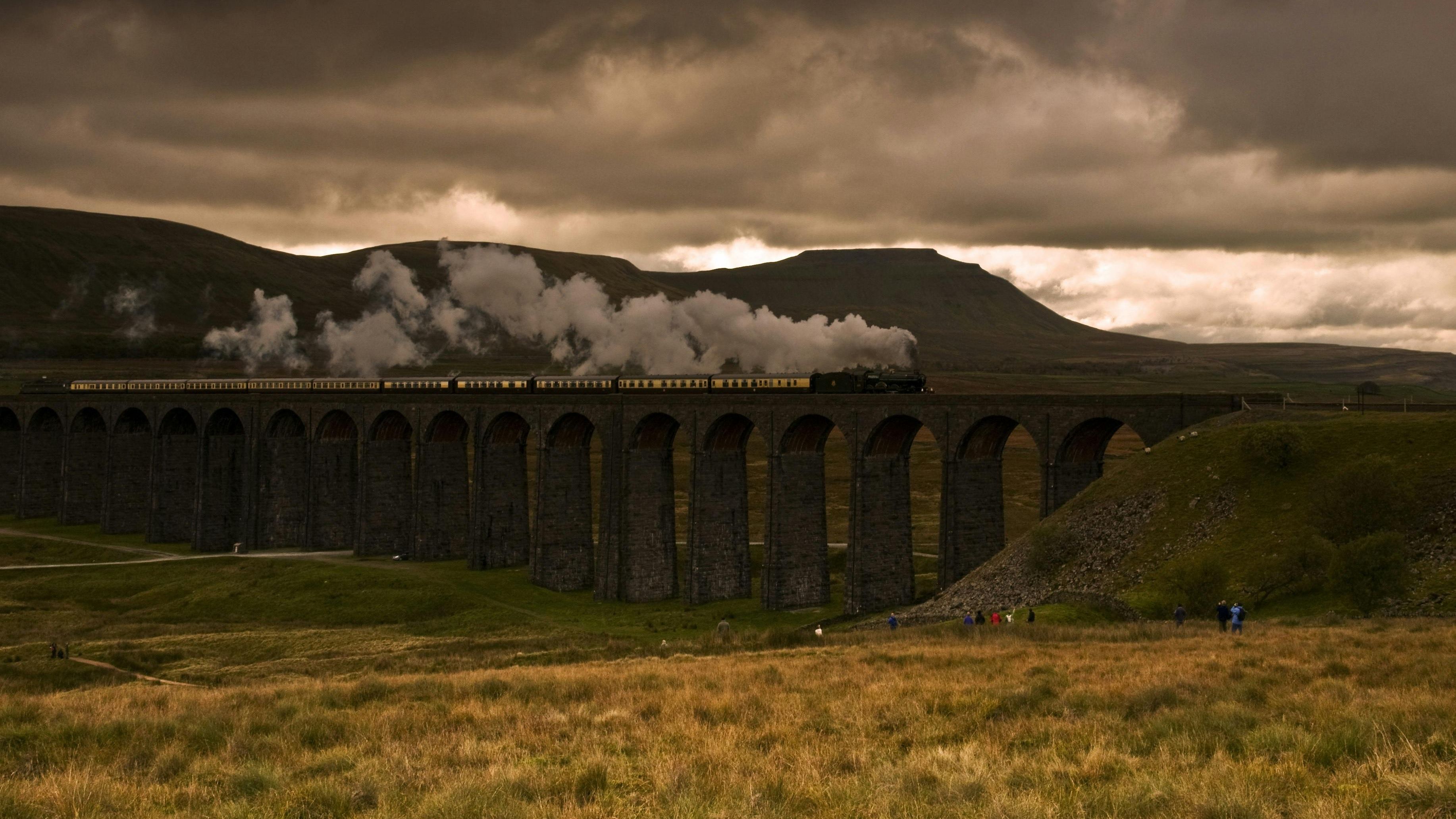 Yorkshire Dales Ribblehead Viaduct with a train passing in the autumnal weather.
