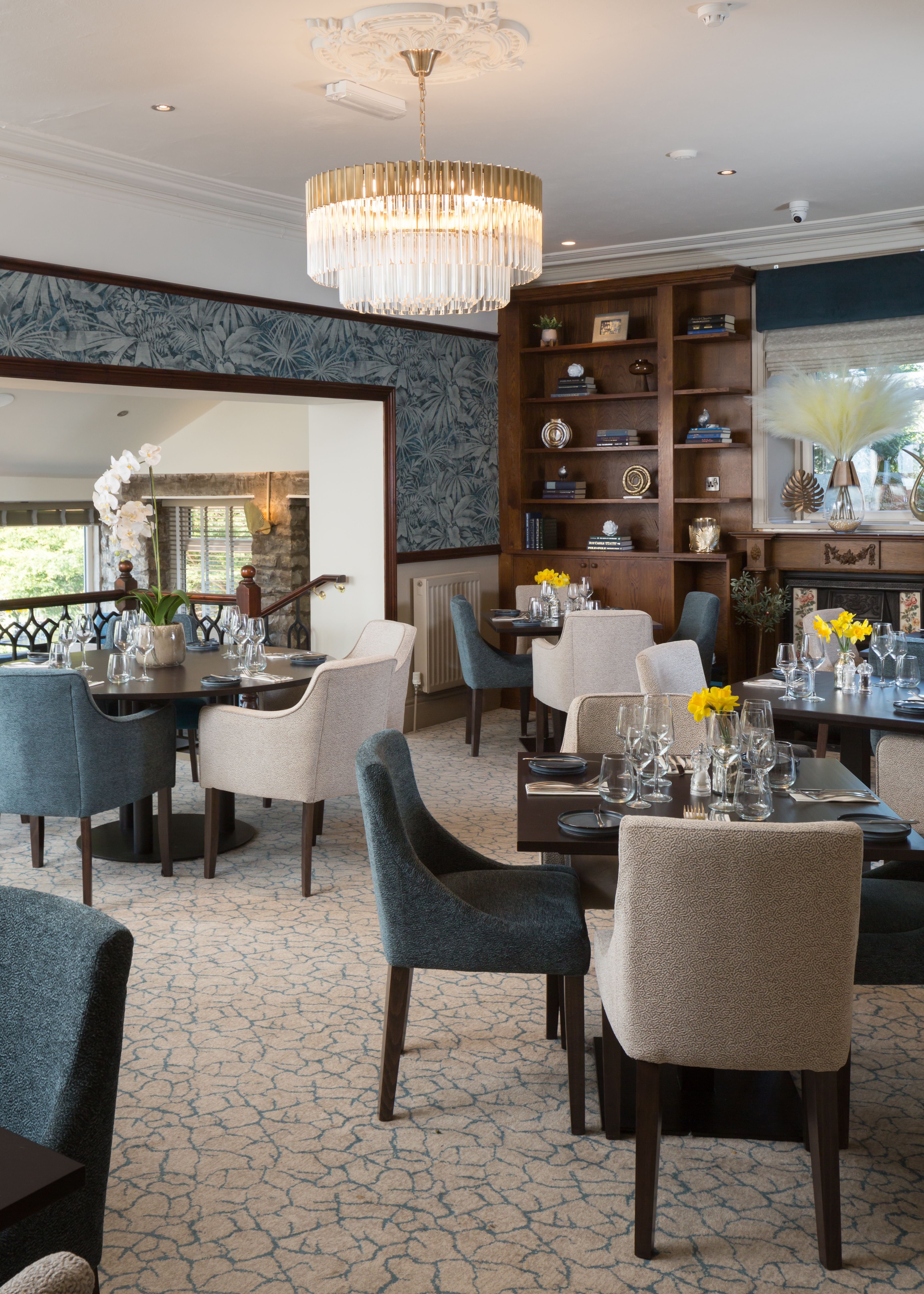 Elegant restaurant dining area with modern decor and chandelier