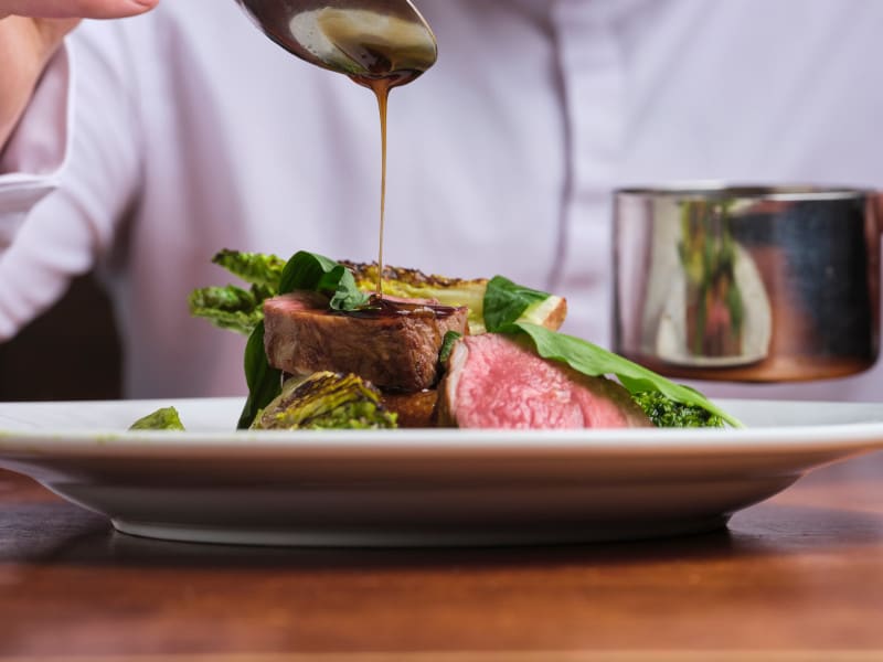 Gravy being poured on a Roast