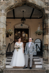 Bride and groom at the hotel entrance