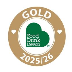 Food Drink Devon Gold Award 2025/26 badge on a gold circular background