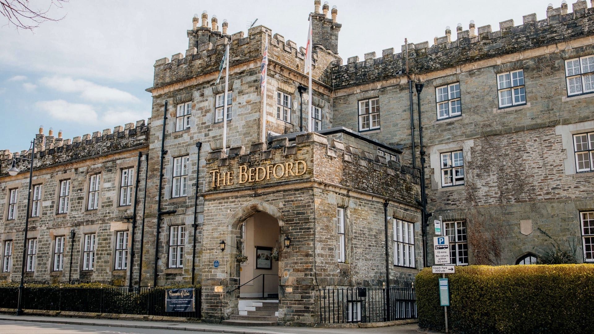Historic stone building with 'The Bedford' sign above the entrance