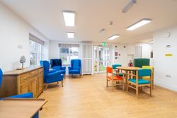 Room with colourful chairs around tables