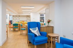 Room with colourful chairs around tables