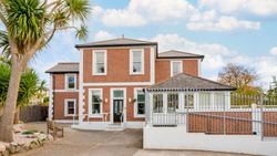 A red-brick building with white trim A red-brick building with white trim A red-brick building with white trim