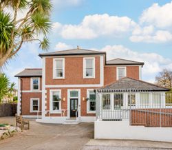 A red-brick building with white trim A red-brick building with white trim A red-brick building with white trim