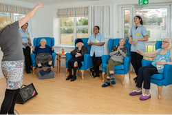 Entertainer singing for residents of care home
