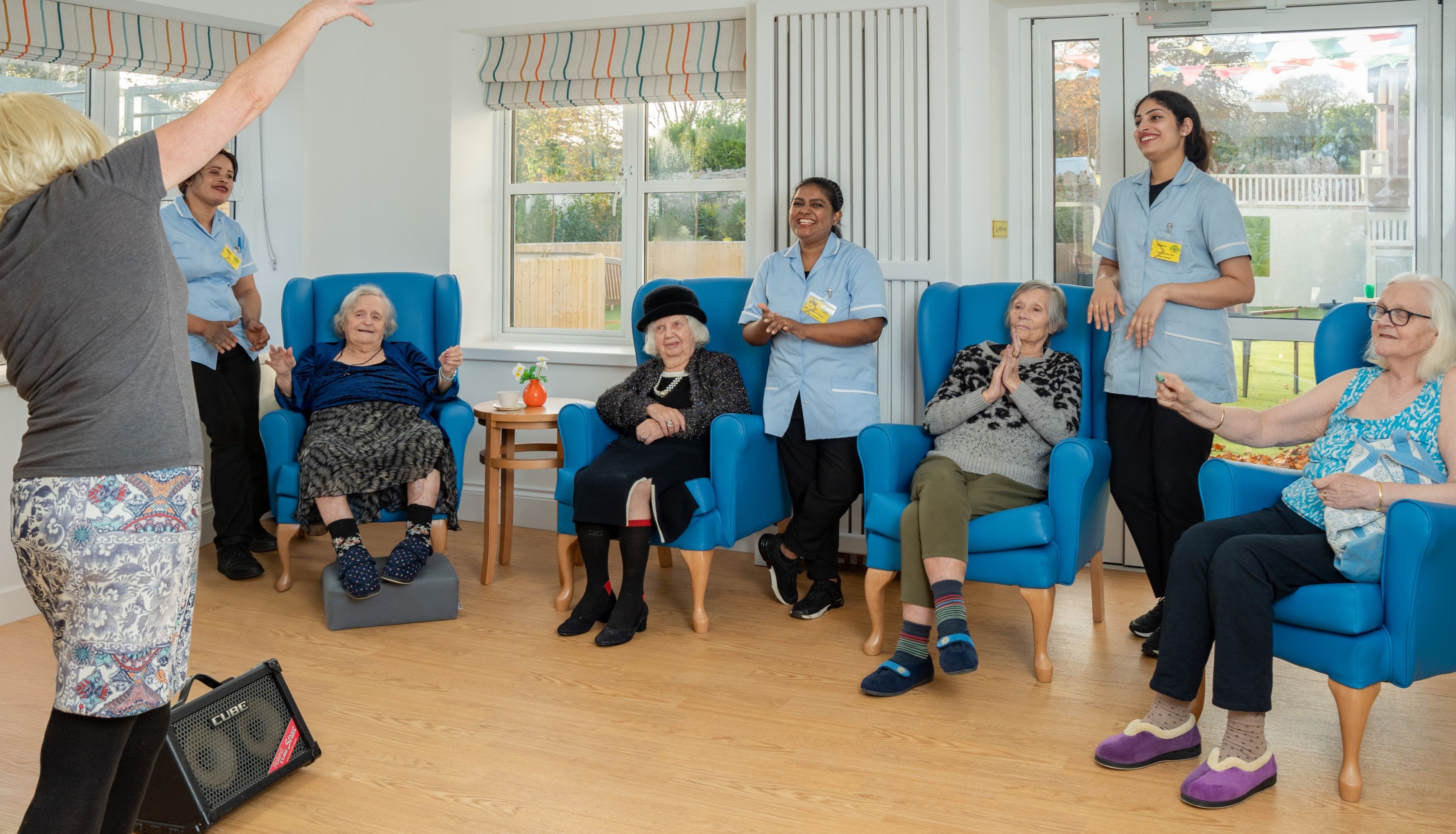 Entertainer singing for residents of care home