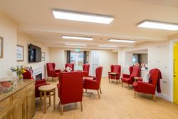 Living area with red armchairs