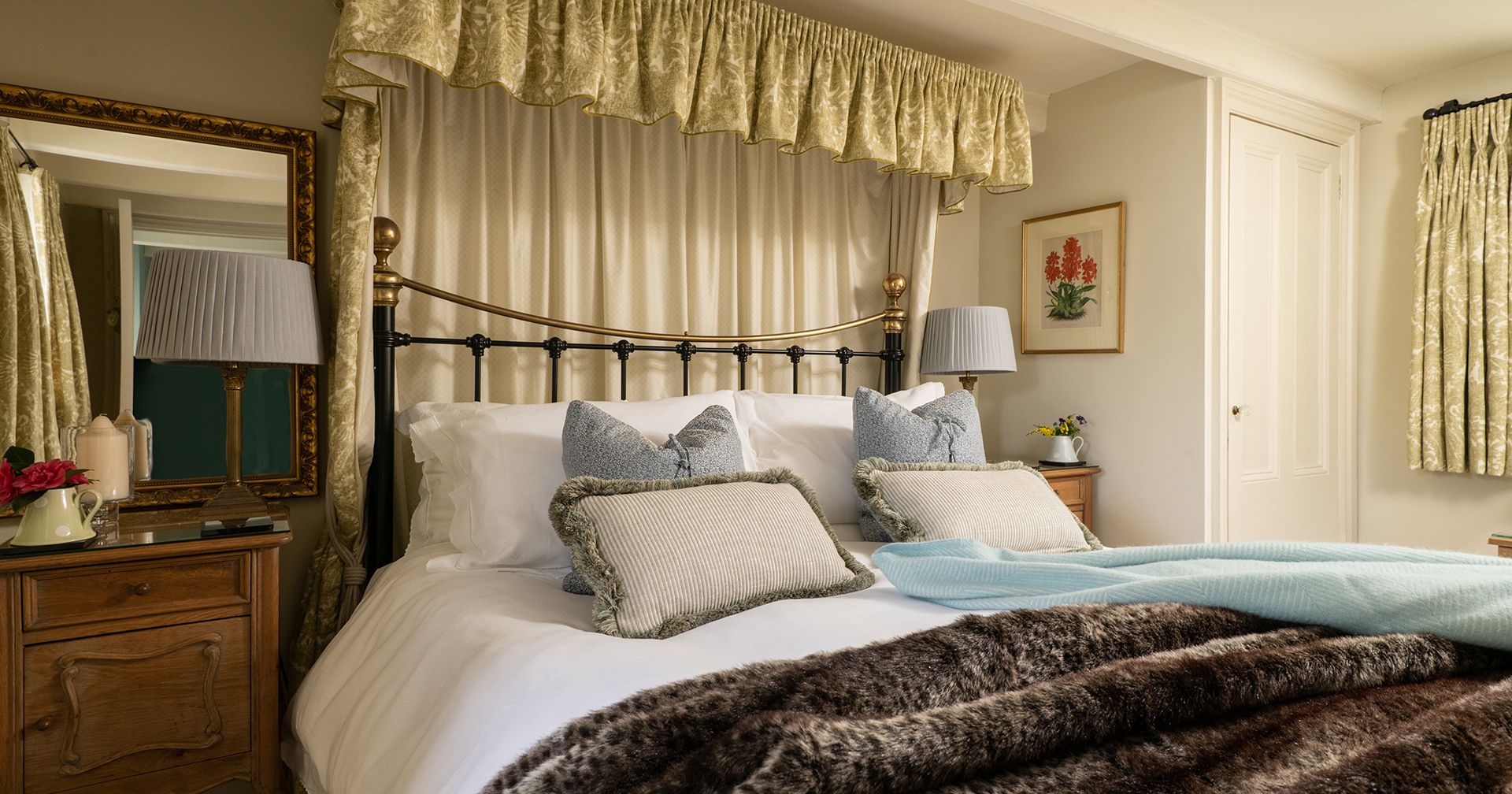 king size bed with soft furnishings around the head board