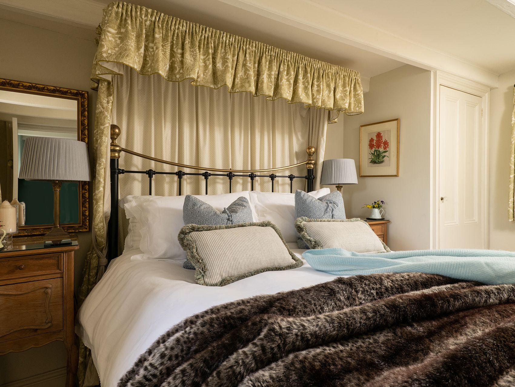 king size bed with soft furnishings around the head board