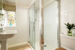 shower room with large walk in shower