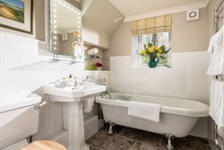 bathroom with freestanding bath