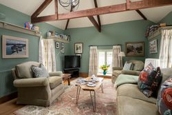 lounge in peace and plenty with soft furnishings and beams