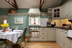 open plan living area made up of the kitchen dining area and lounge