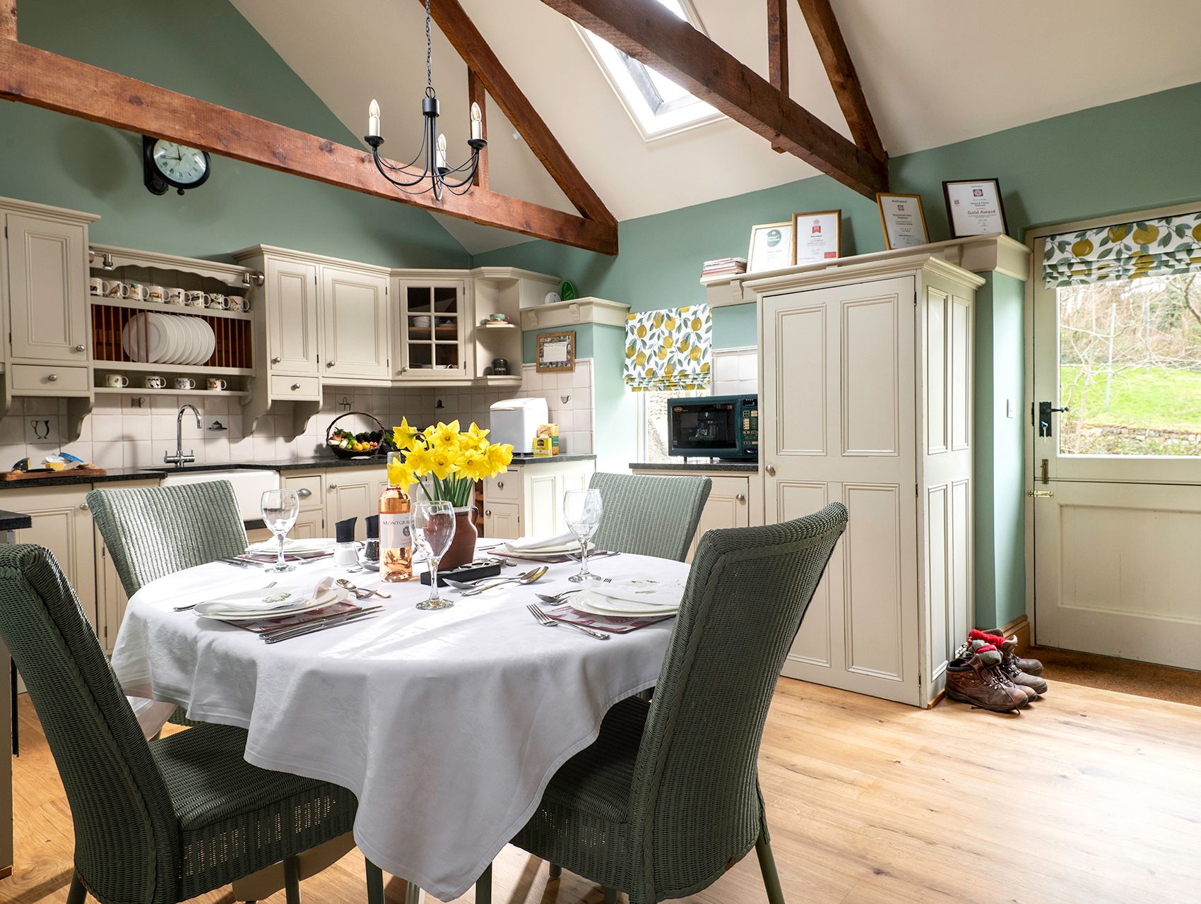 table for four set up with daffodils on the table