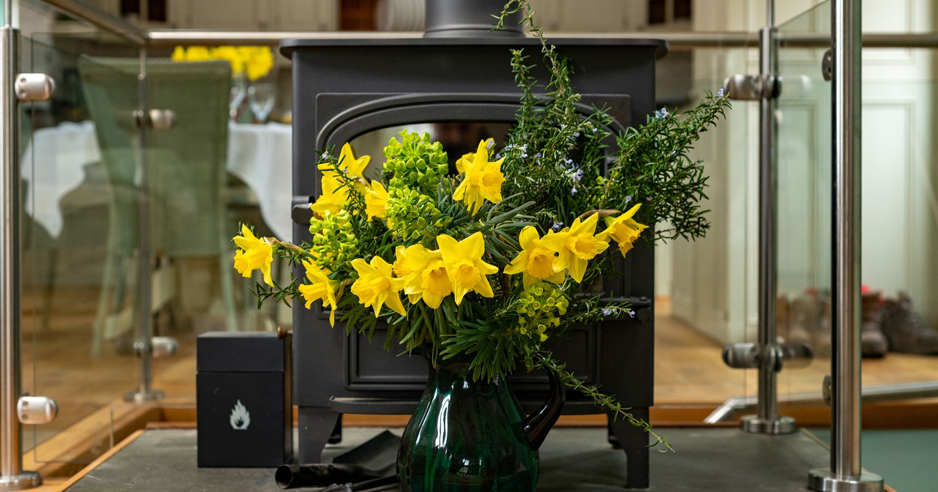 fireplace with flowers in front of it