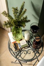 table with vase and glass of wine