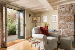 ring and thimble lounge with french doors opening into the garden