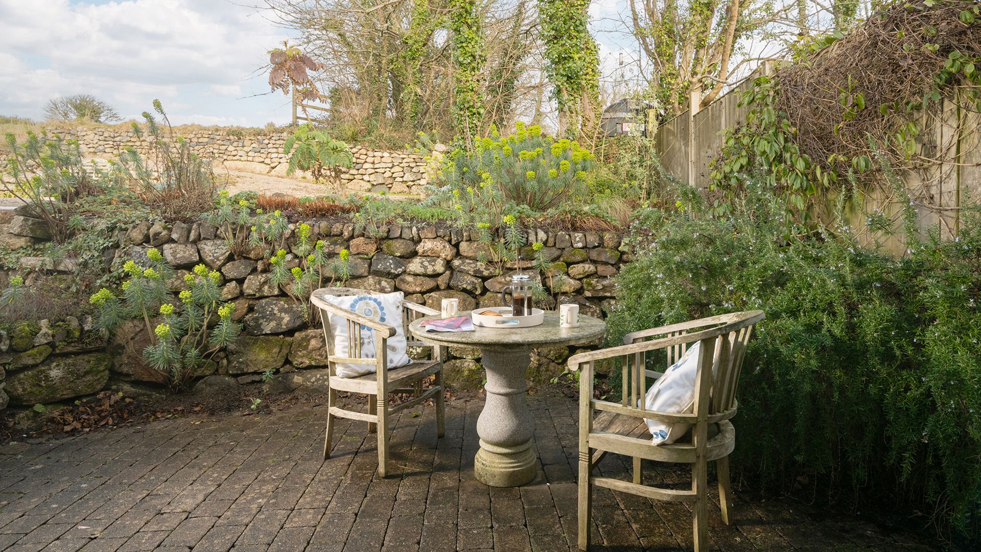 decking area with table and chairs