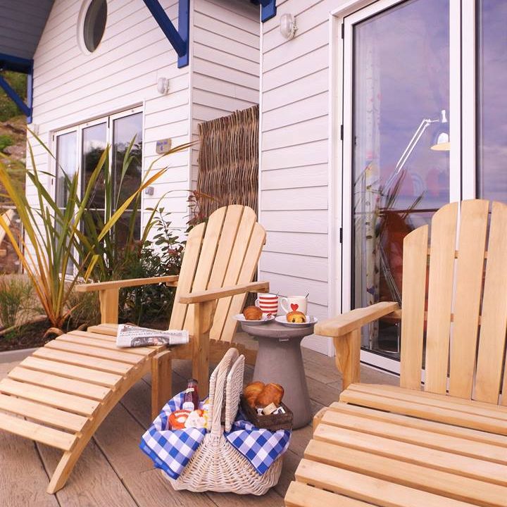 Beach huts outside loungers