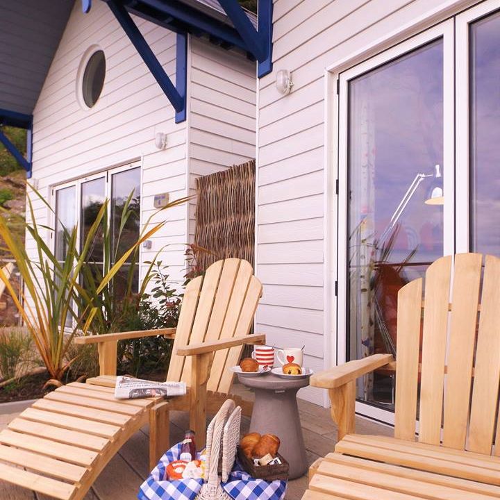 Beach huts outside loungers