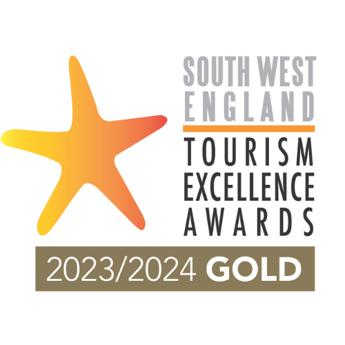 South West England Tourism Excellence Awards 2023/2024 Gold badge with a yellow and orange starfish