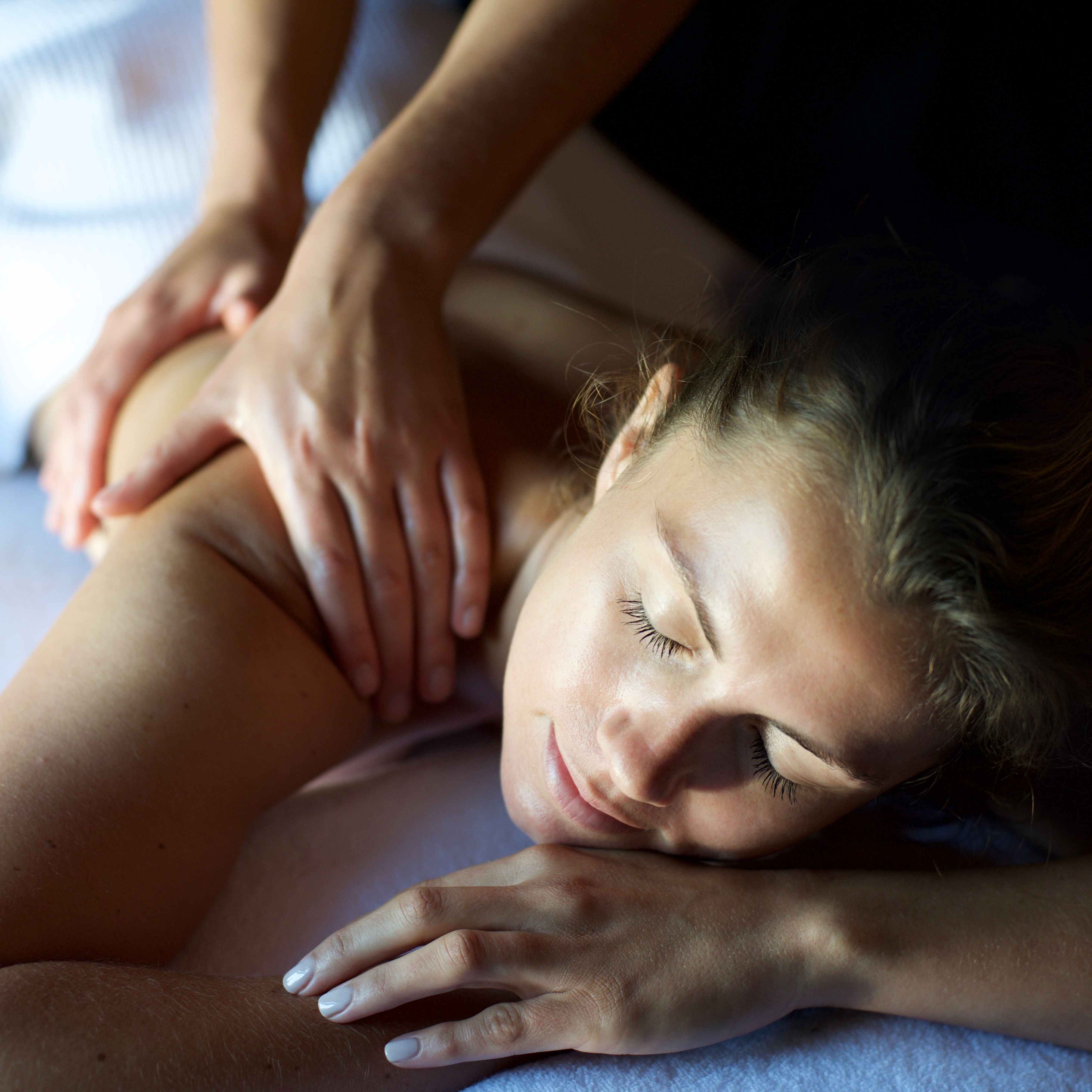 Woman enjoying a relaxing shoulder massage