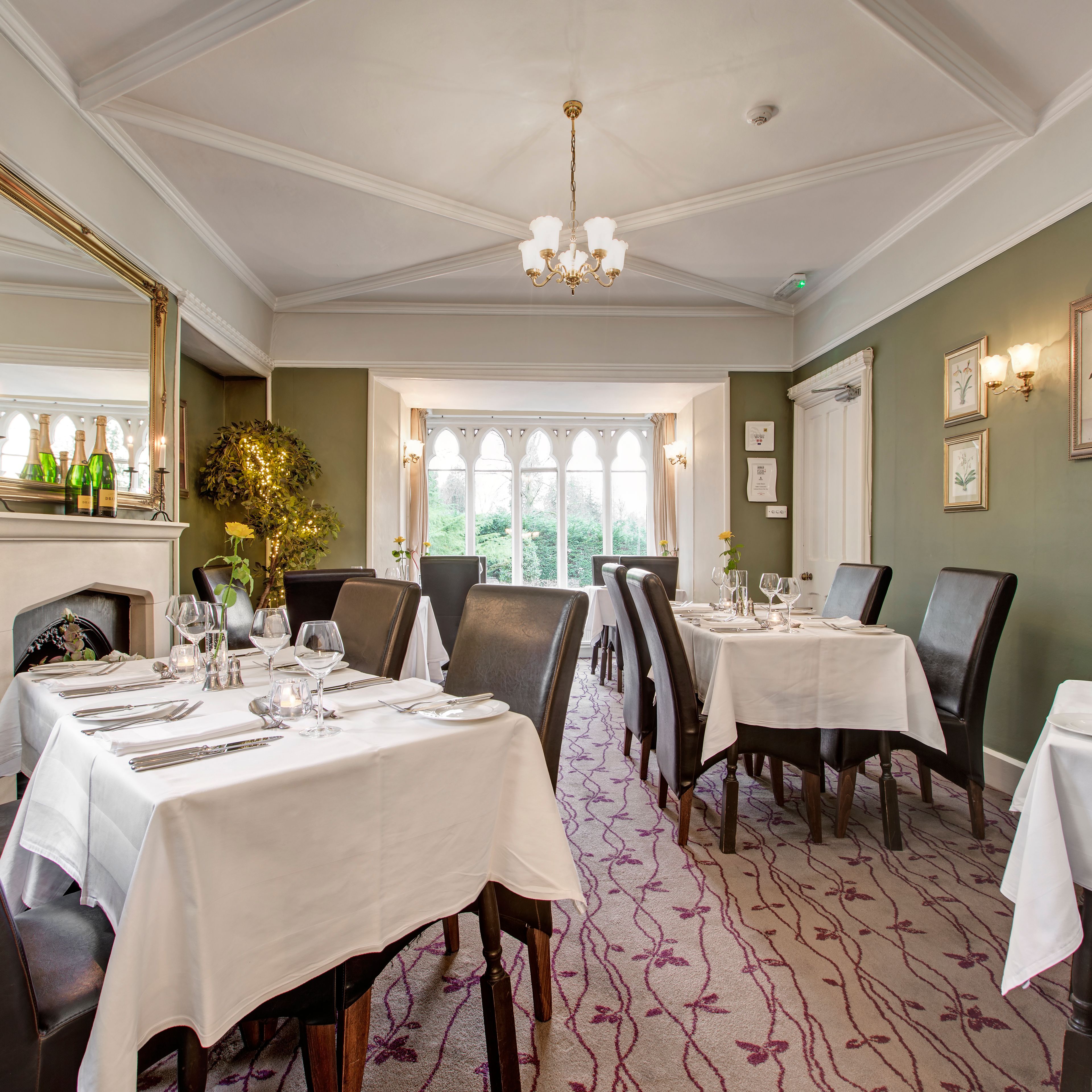 Elegant restaurant dining room with tables set for service