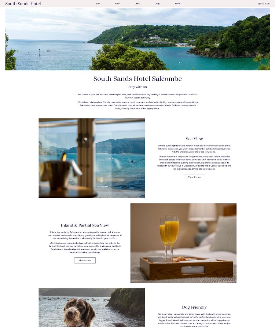 South Sands Hotel overlooking a serene coastal bay with lush green hills and turquoise water.