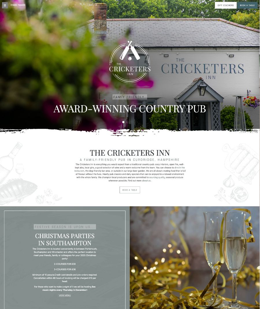 Exterior view of The Cricketers Inn, a country pub in Curdridge, Hampshire, with its signage visible and flowers in the foreground.