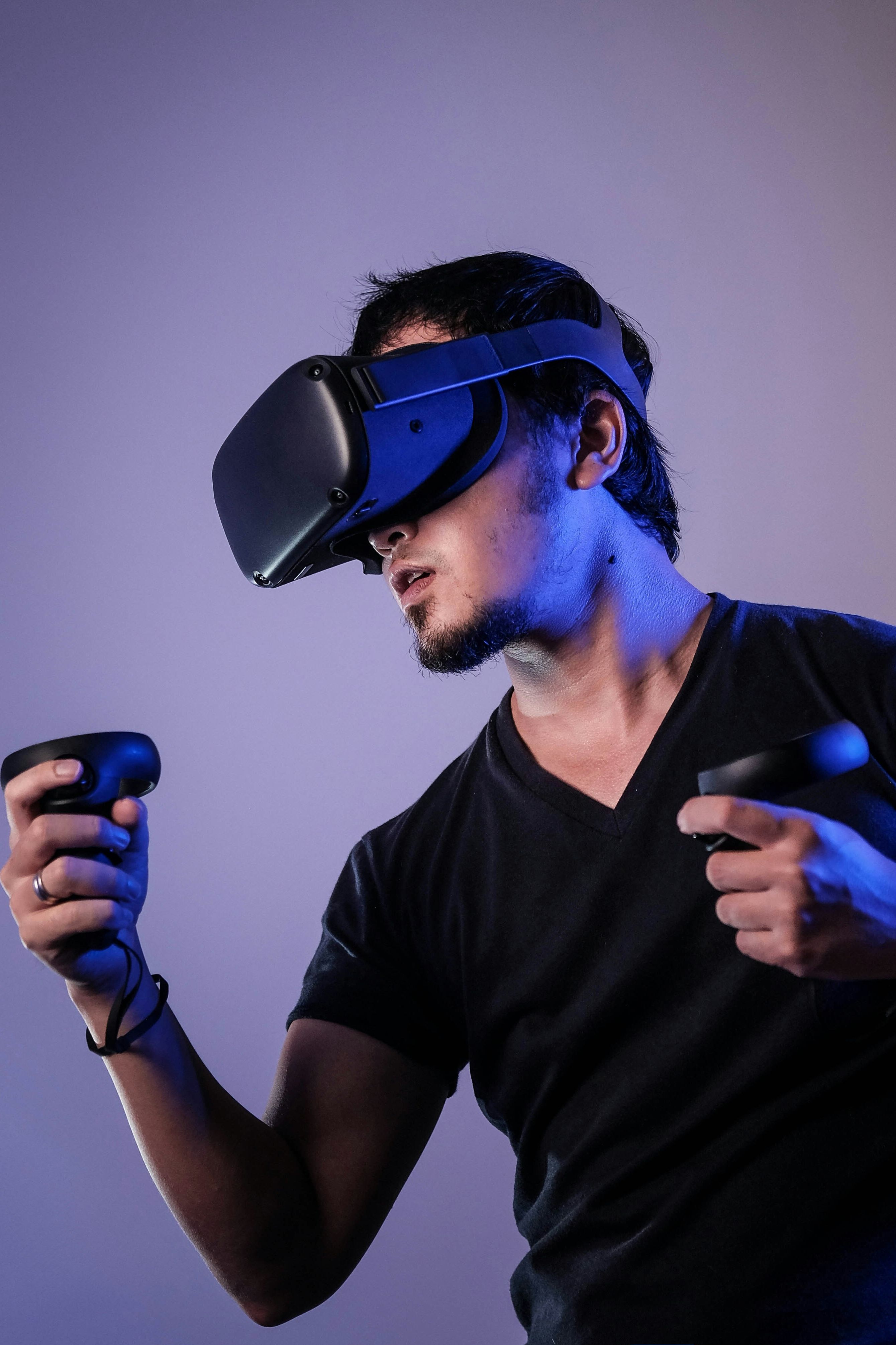 Person using a virtual reality headset and controllers