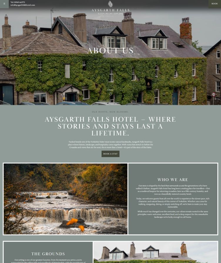 Aysgarth Falls Hotel covered in ivy with historic architecture and a scenic waterfall in autumn.