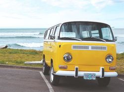Yellow camper van by the sea