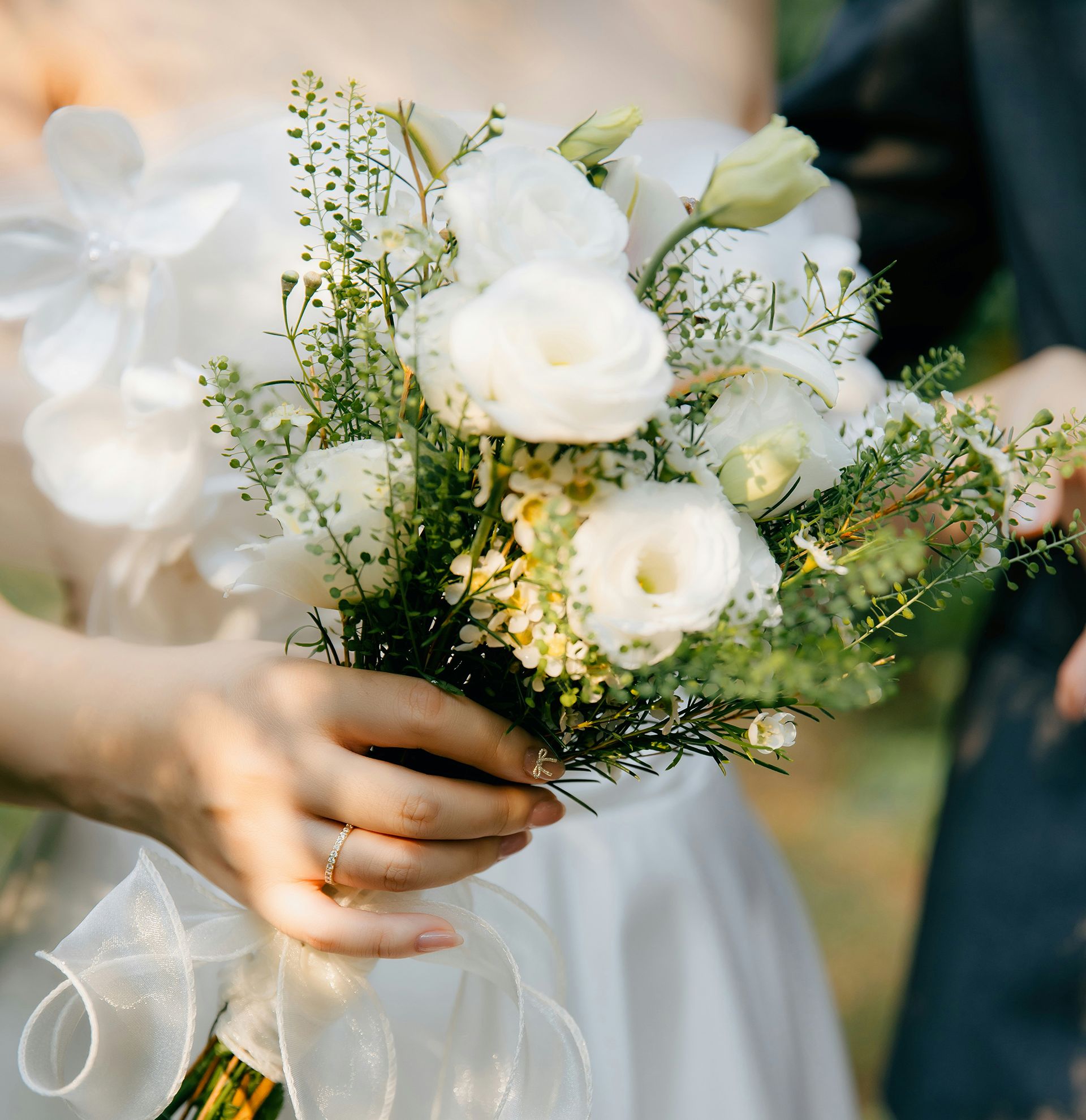 Bride holding white flowers
