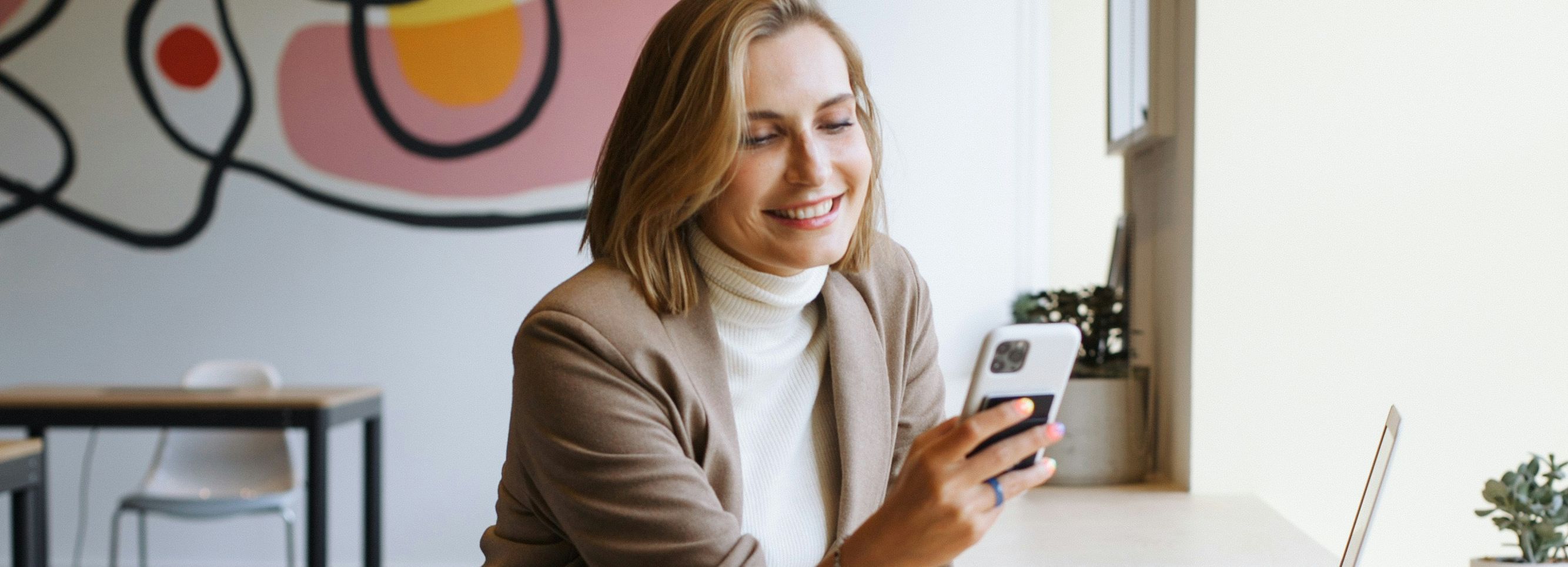 Woman in cafe with laptop