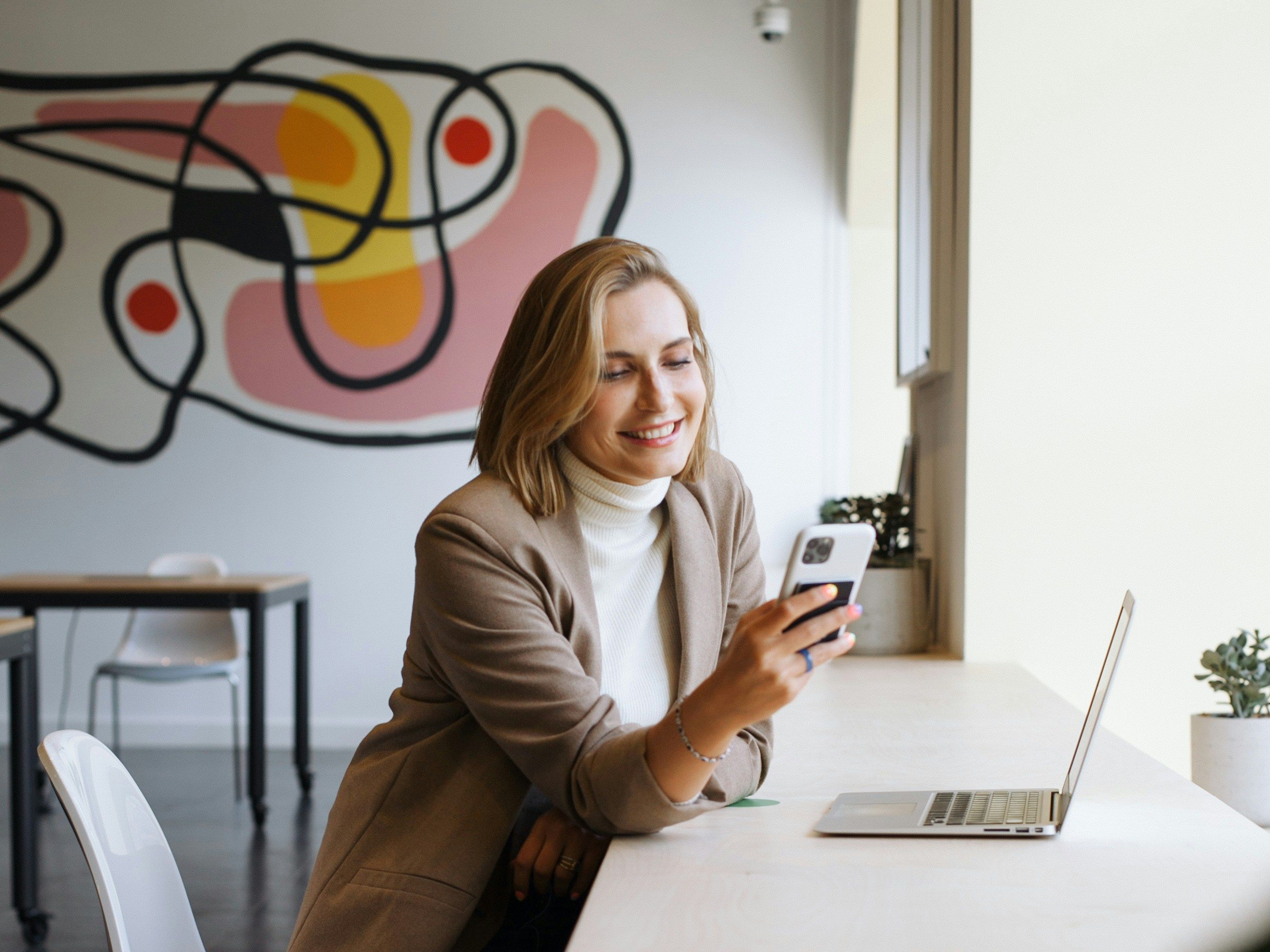 Woman in cafe with laptop