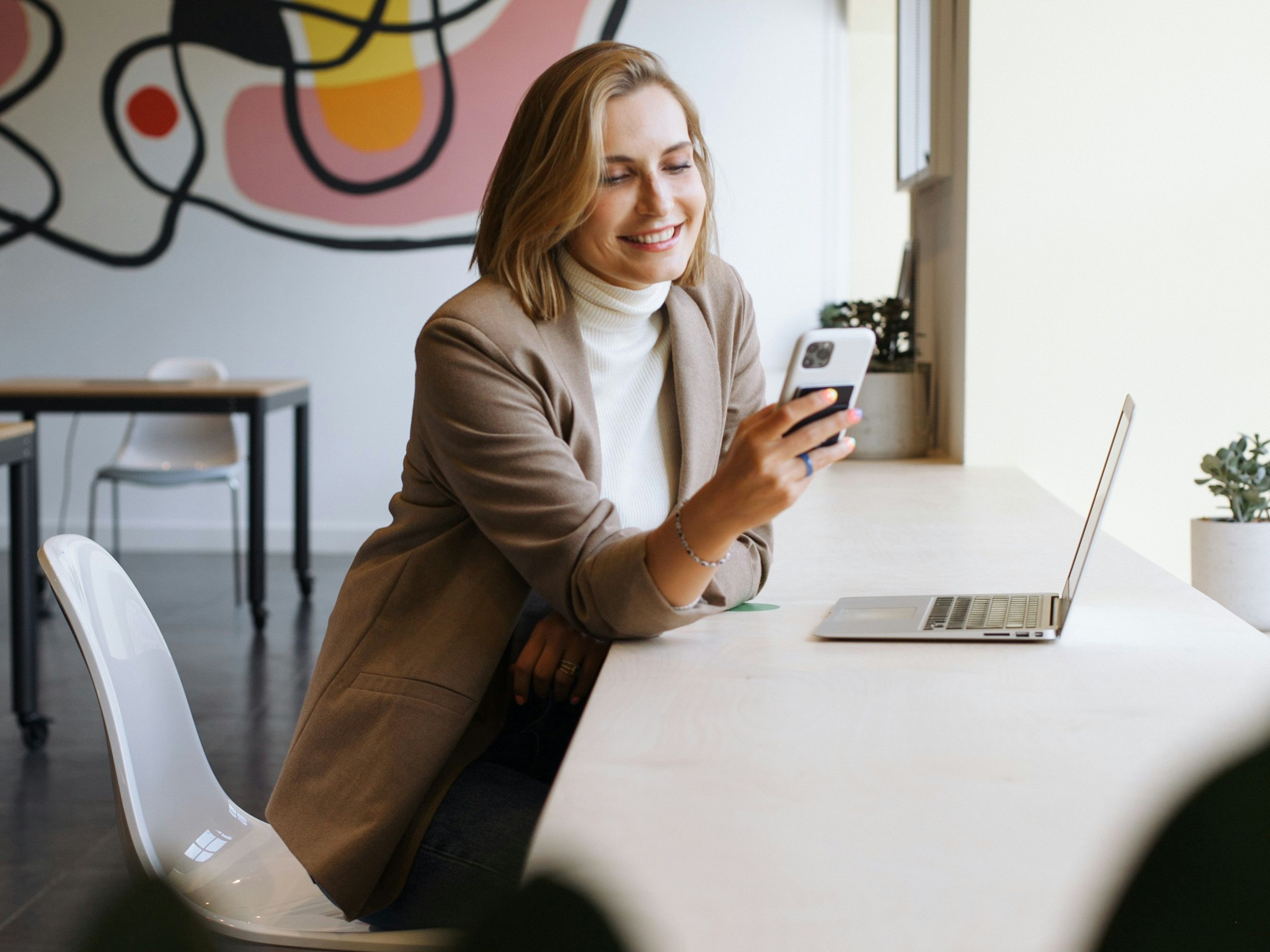 Woman in cafe with laptop