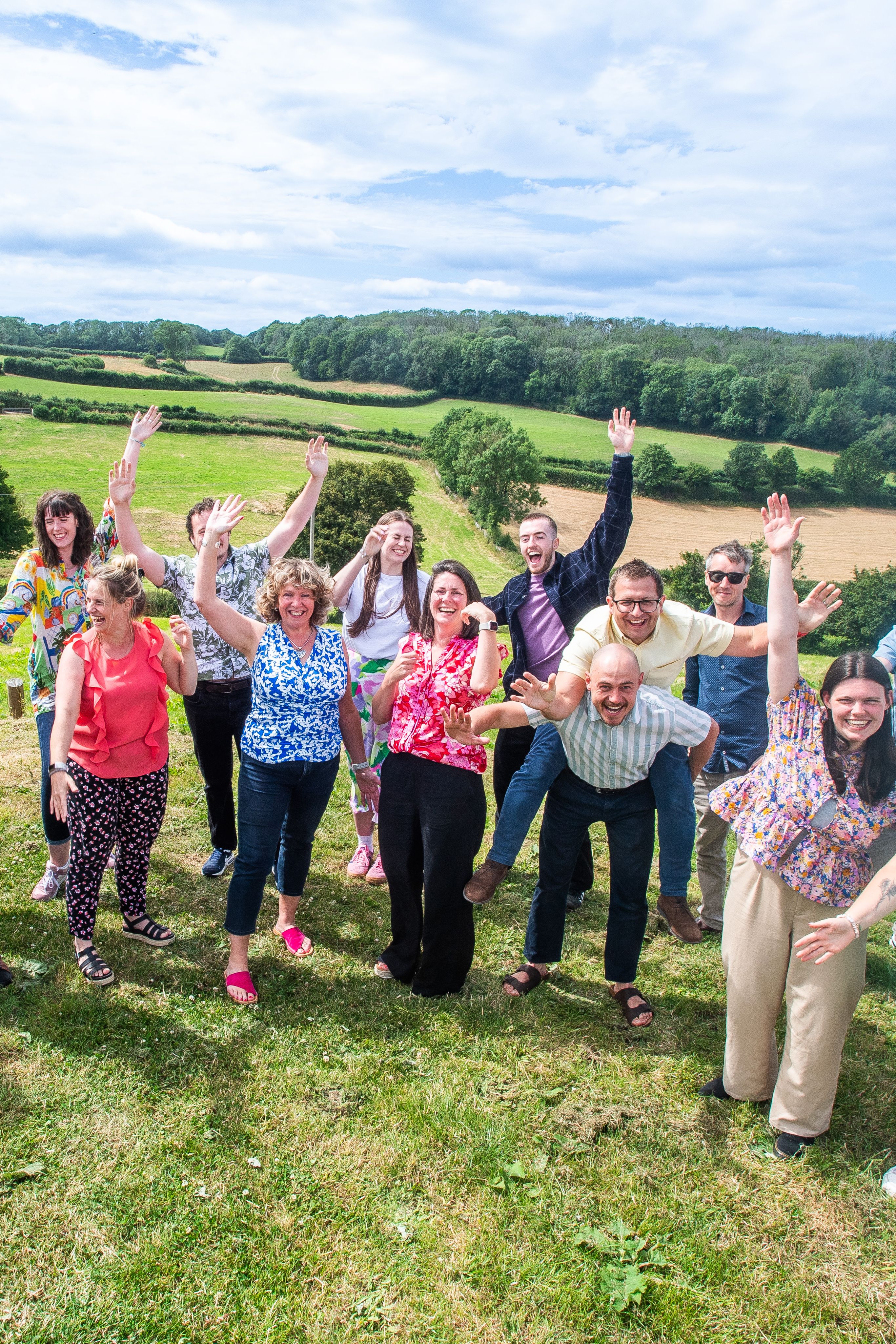 Clockwork Marketing Team Raising Hands