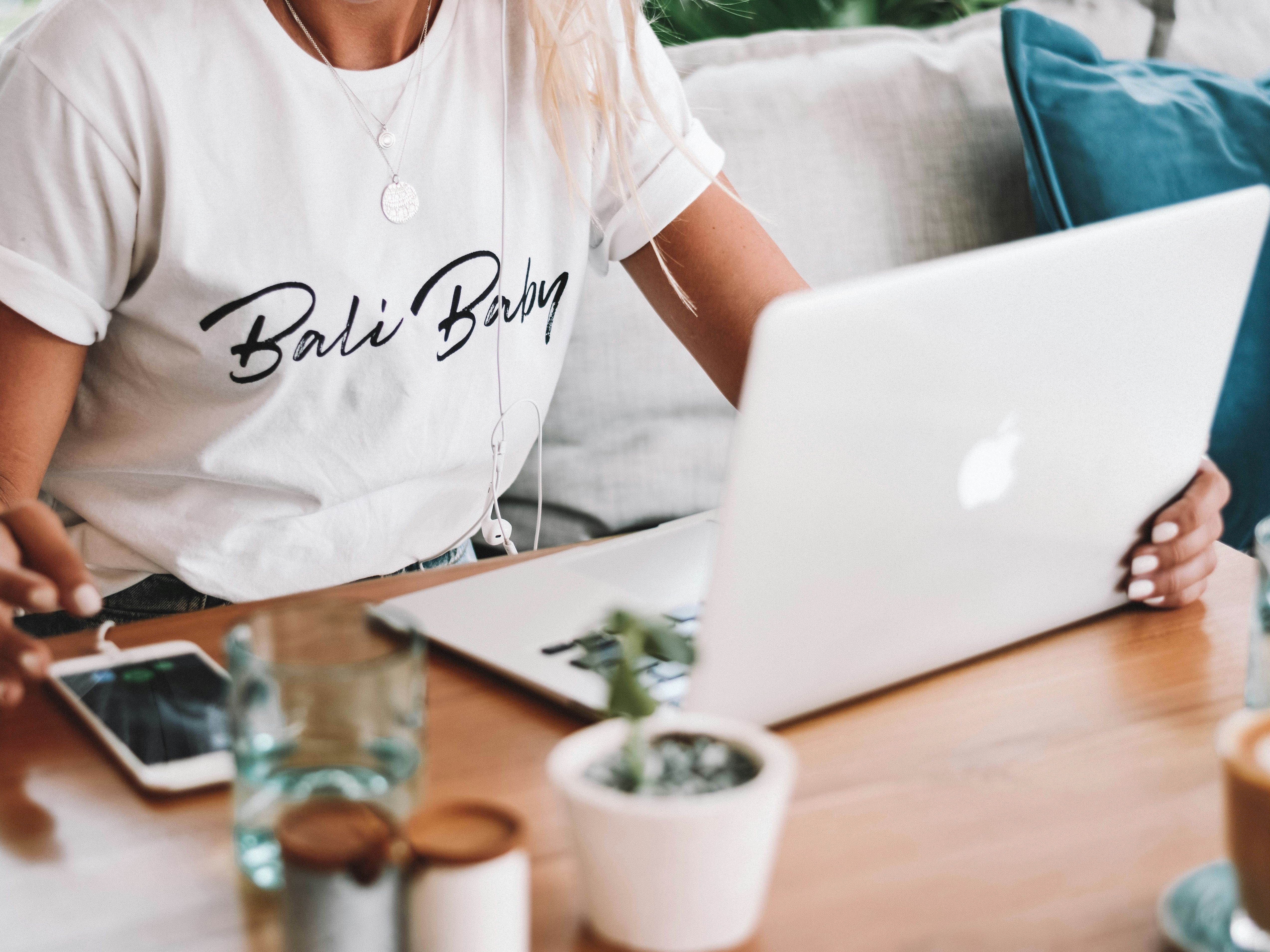 Lady on her laptop with phone