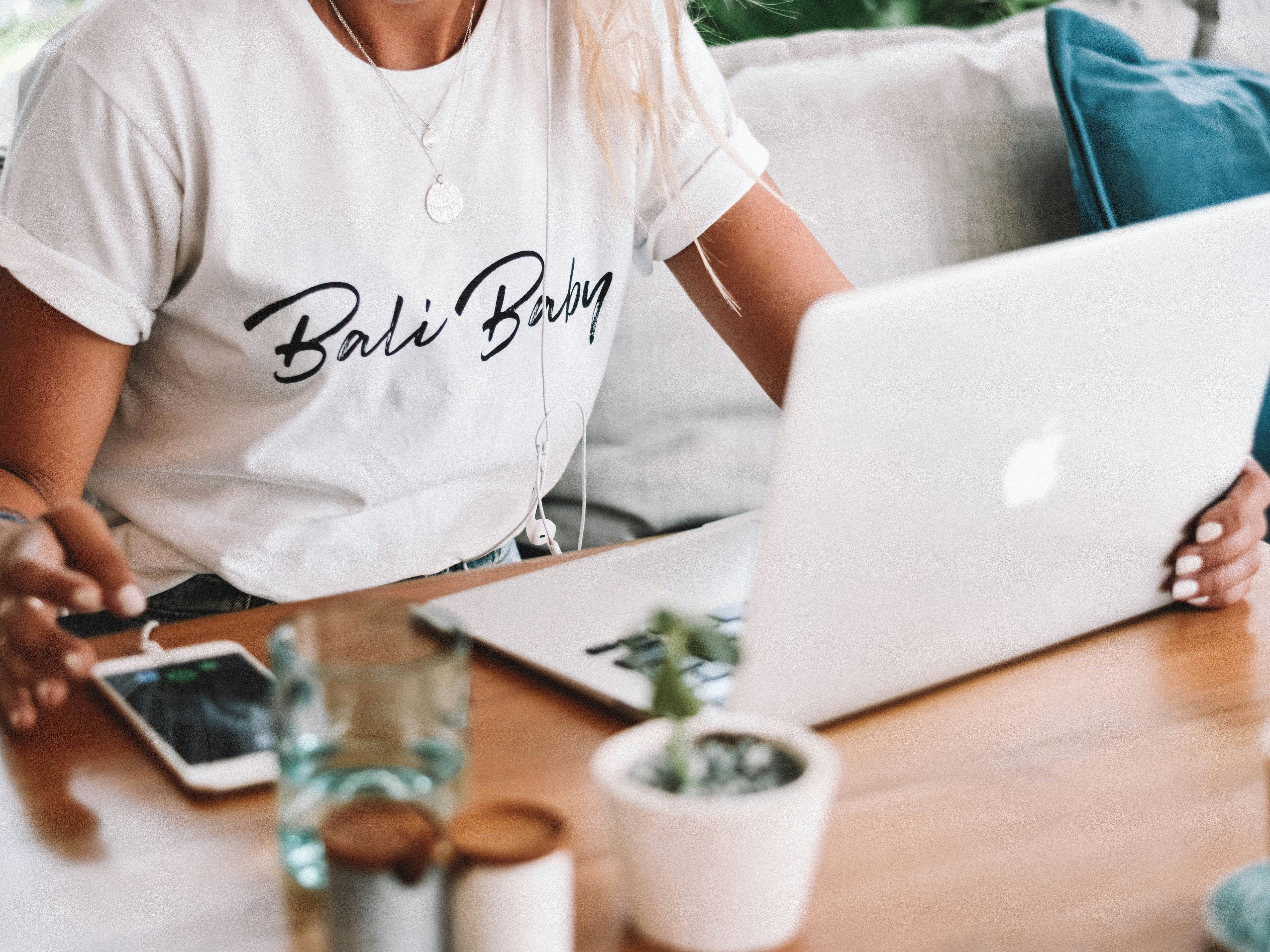 Lady on her laptop with phone
