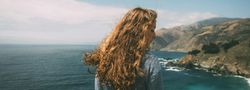Girl by coast