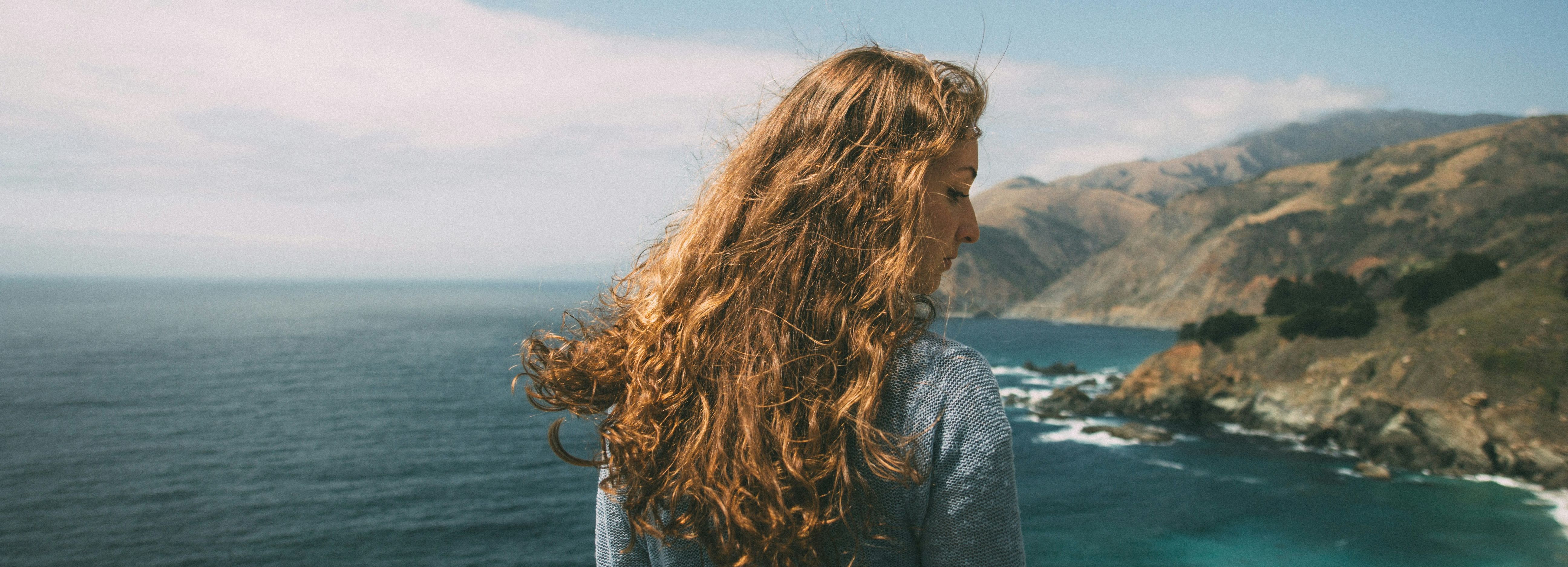 Girl by coast