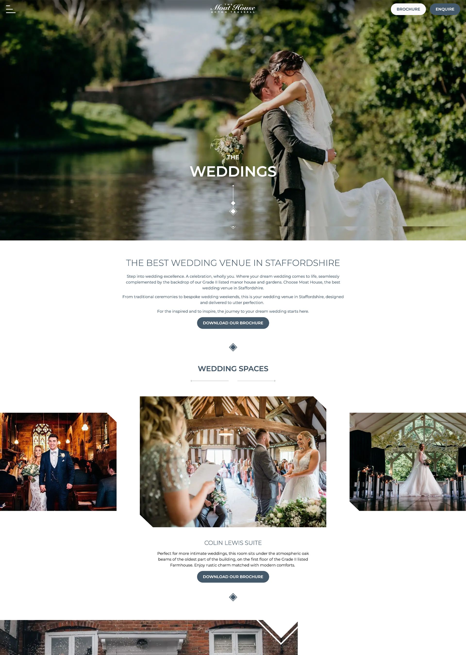 Bride and groom embracing by a riverside at a wedding venue, with a stone bridge in the background.
