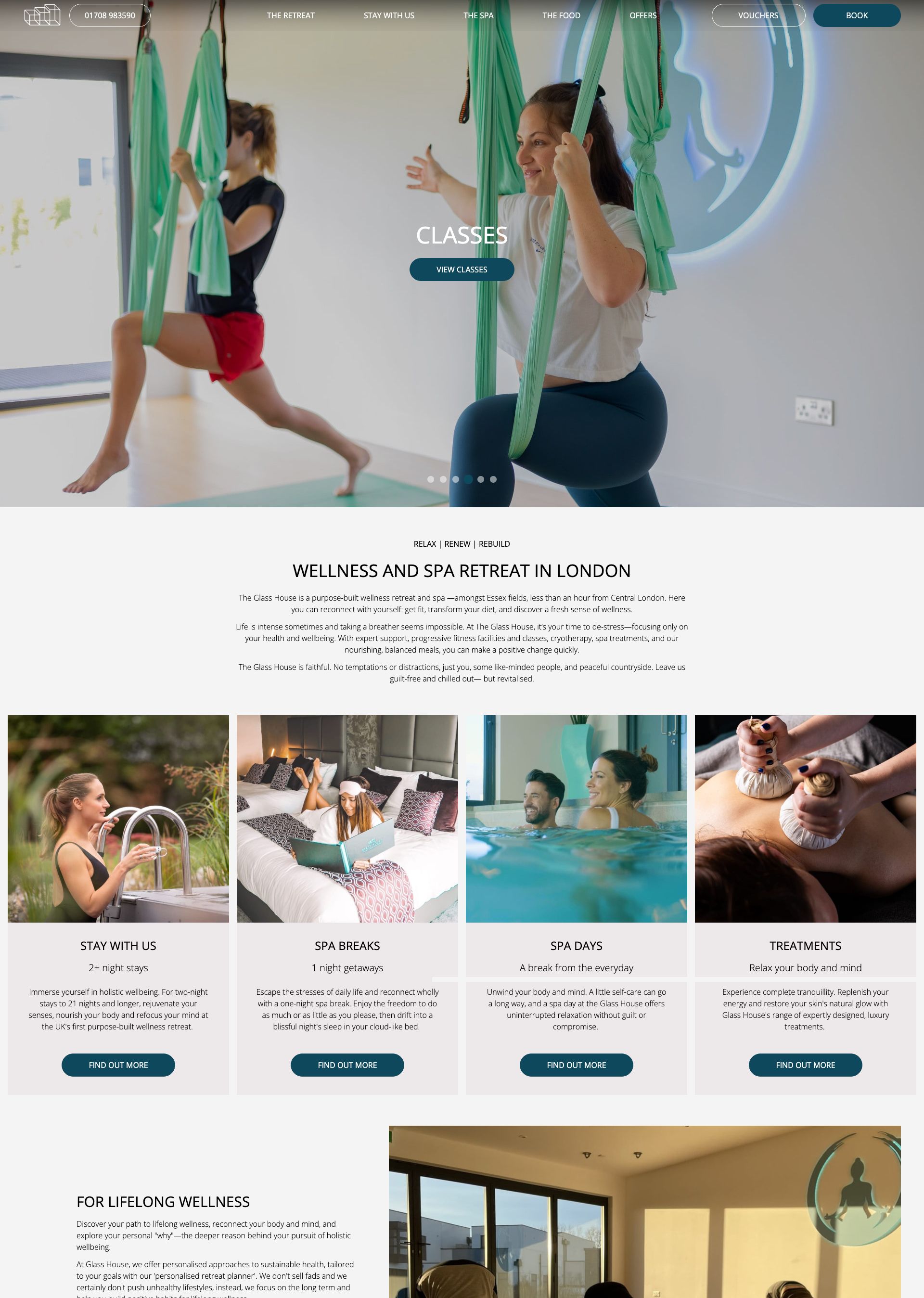 Women practicing aerial yoga with fabric hammocks in a bright fitness studio at a wellness retreat.