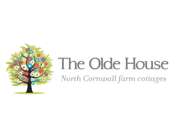The Olde House North Cornwall farm cottages logo with a colorful tree