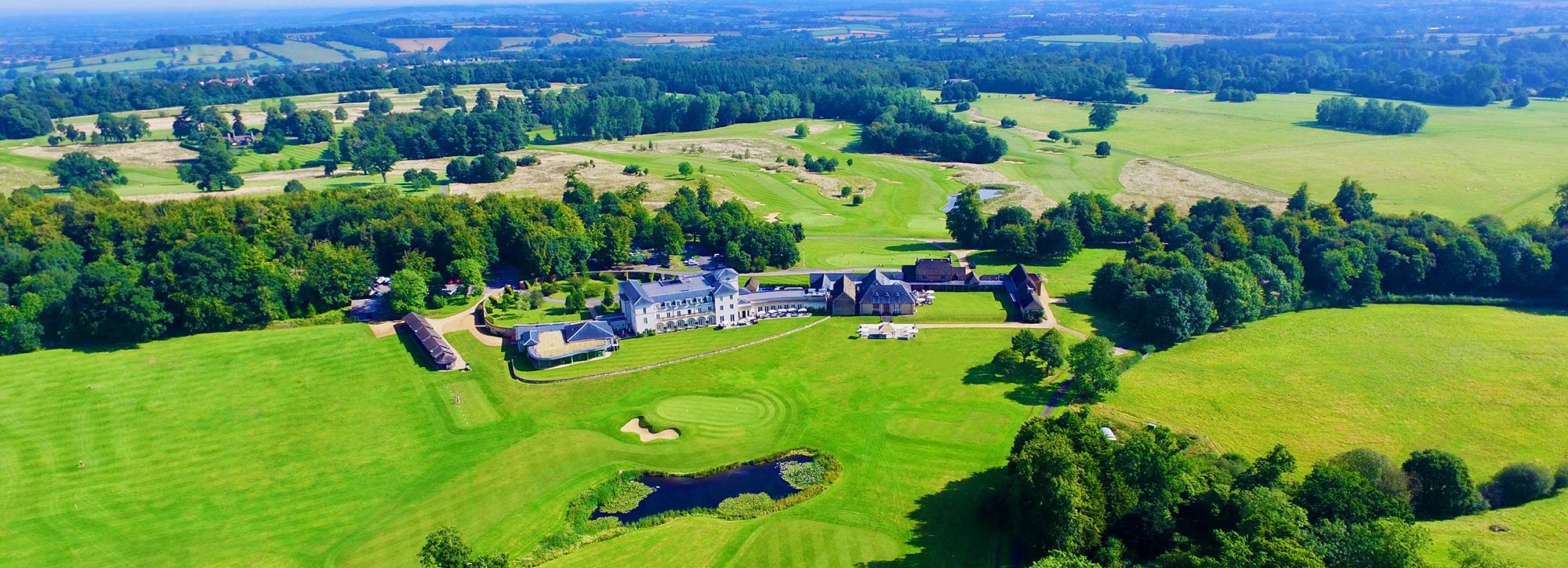 Aerial view of Bowood estate with mansion and surrounding green landscape