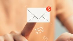 Person tapping on a virtual email icon with a notification badge